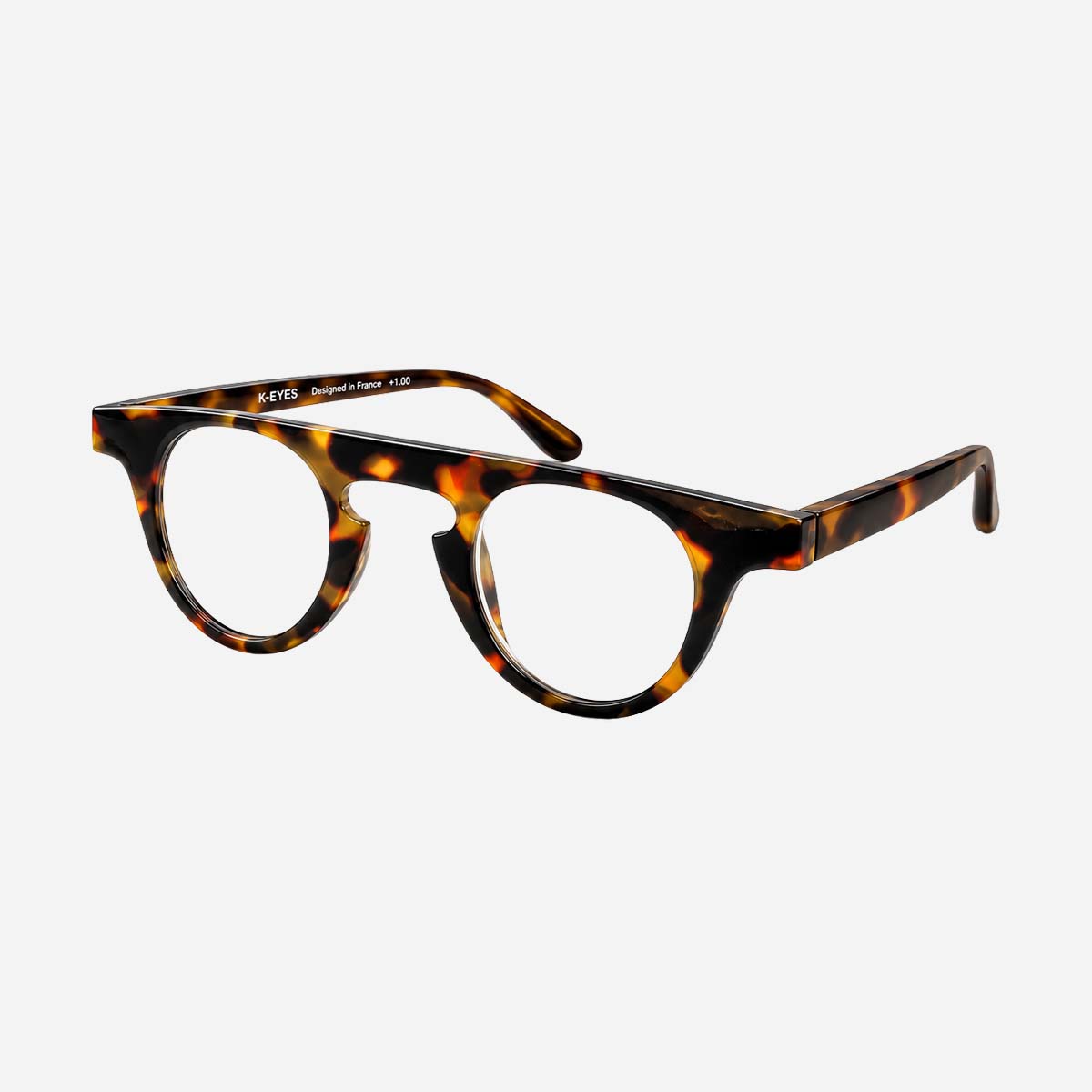 Lunettes de lecture unisexes à monture ronde, motif écaille.
Unisex reading glasses with a round frame tortoiseshell pattern.