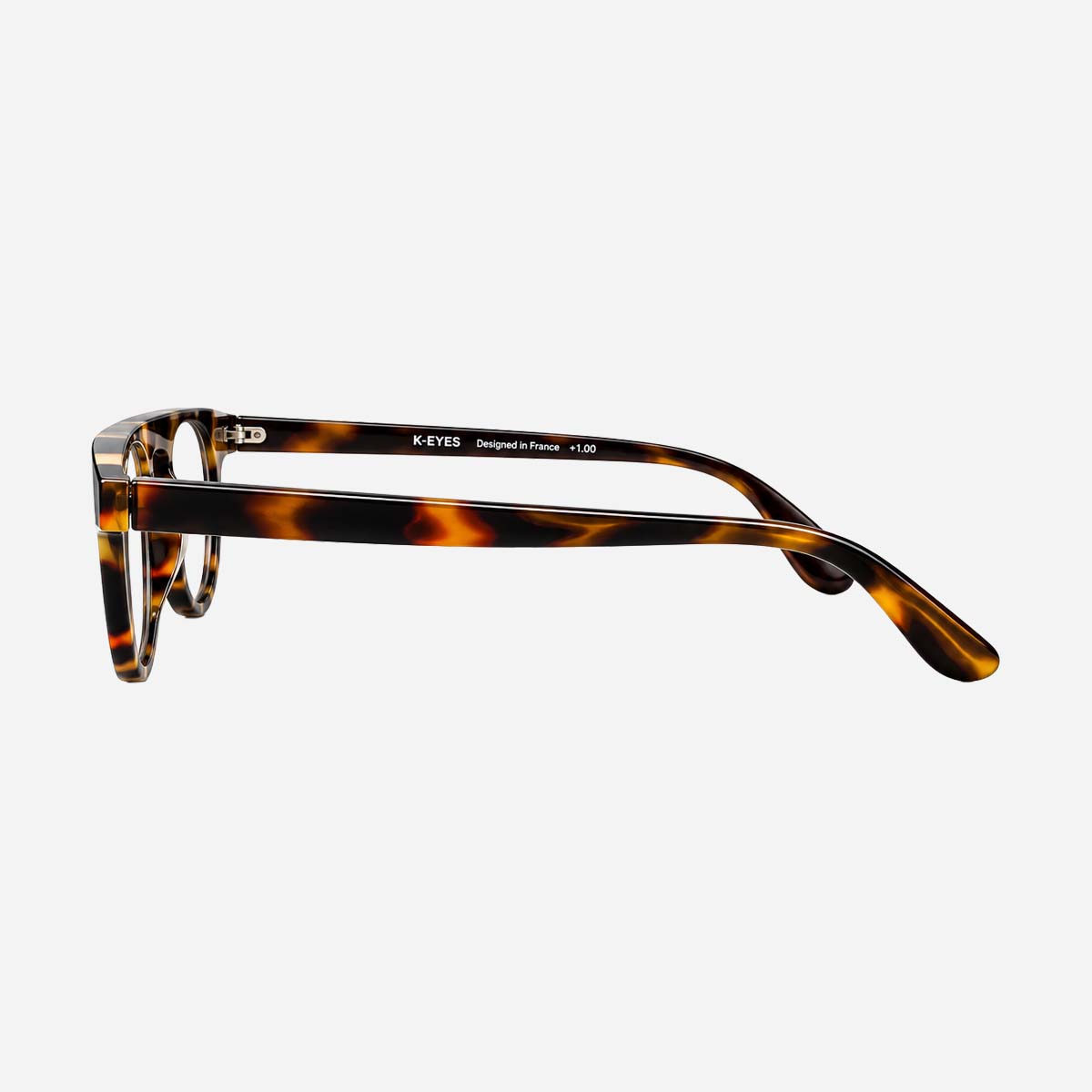 Lunettes de lecture unisexes à monture ronde, motif écaille.
Unisex reading glasses with a round frame tortoiseshell pattern.